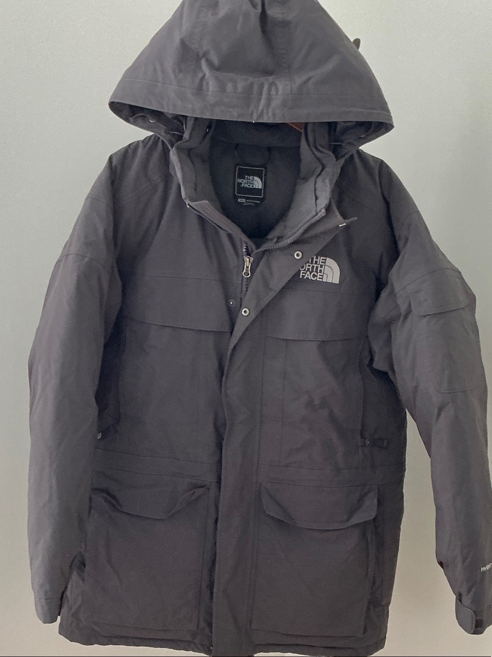 The North Face Men's Hooded Winter Parka - expedition-inspired dark gray parka.
